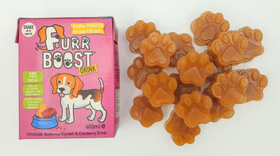 A venison Furr Boost carton on the left with the homemade Furr Boost gummy treats for dogs on the right.