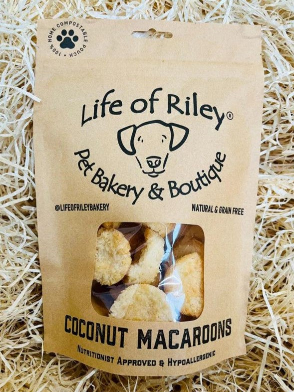 Kraft paper packaging of Life of Riley coconut macaroons on a straw background