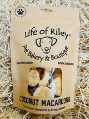 Kraft paper packaging of Life of Riley coconut macaroons on a straw background